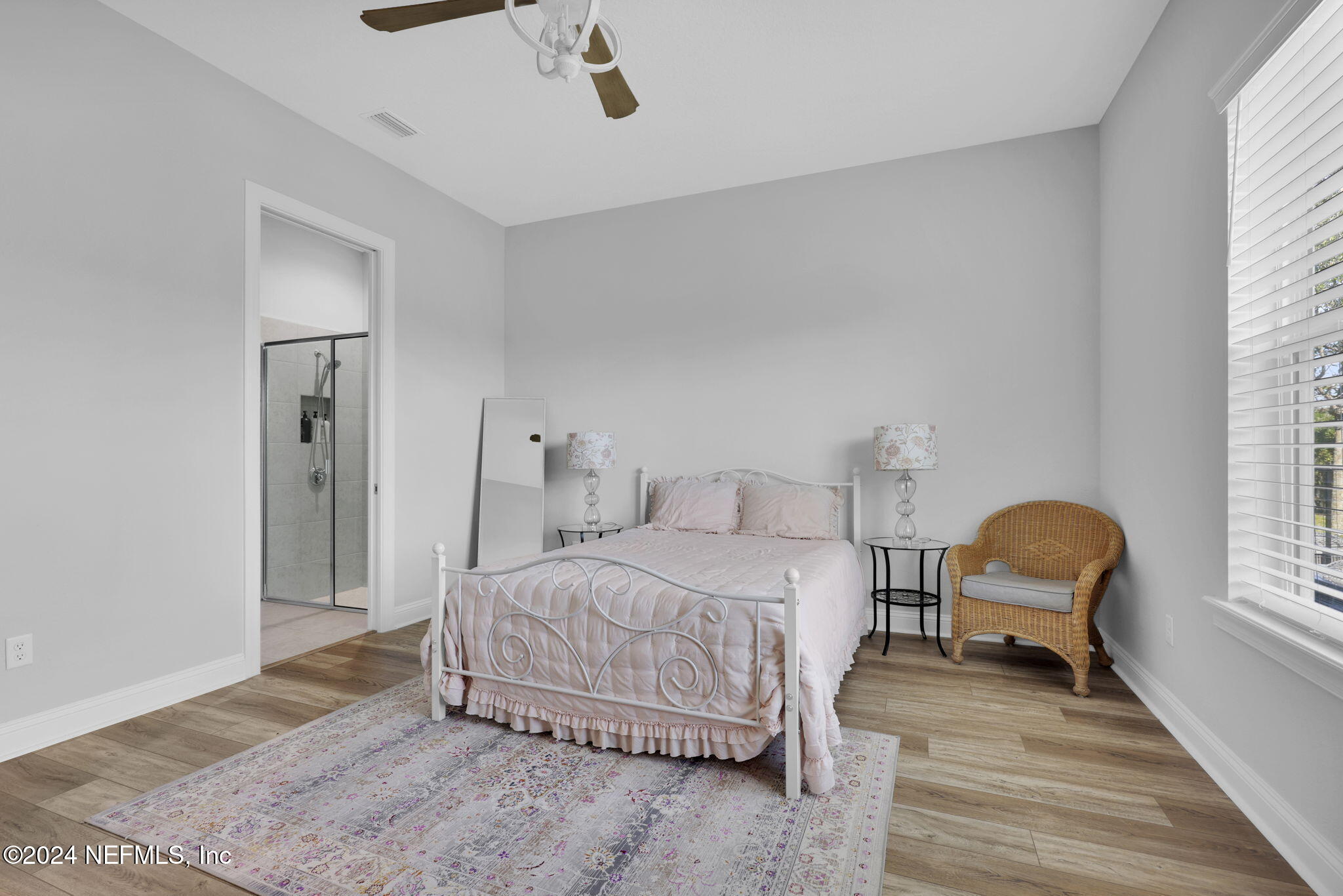 217 Liberty Bell Road Ponte Vedra, FL 32081 - Photo 17 of 50 a bedroom with a bed and a chair