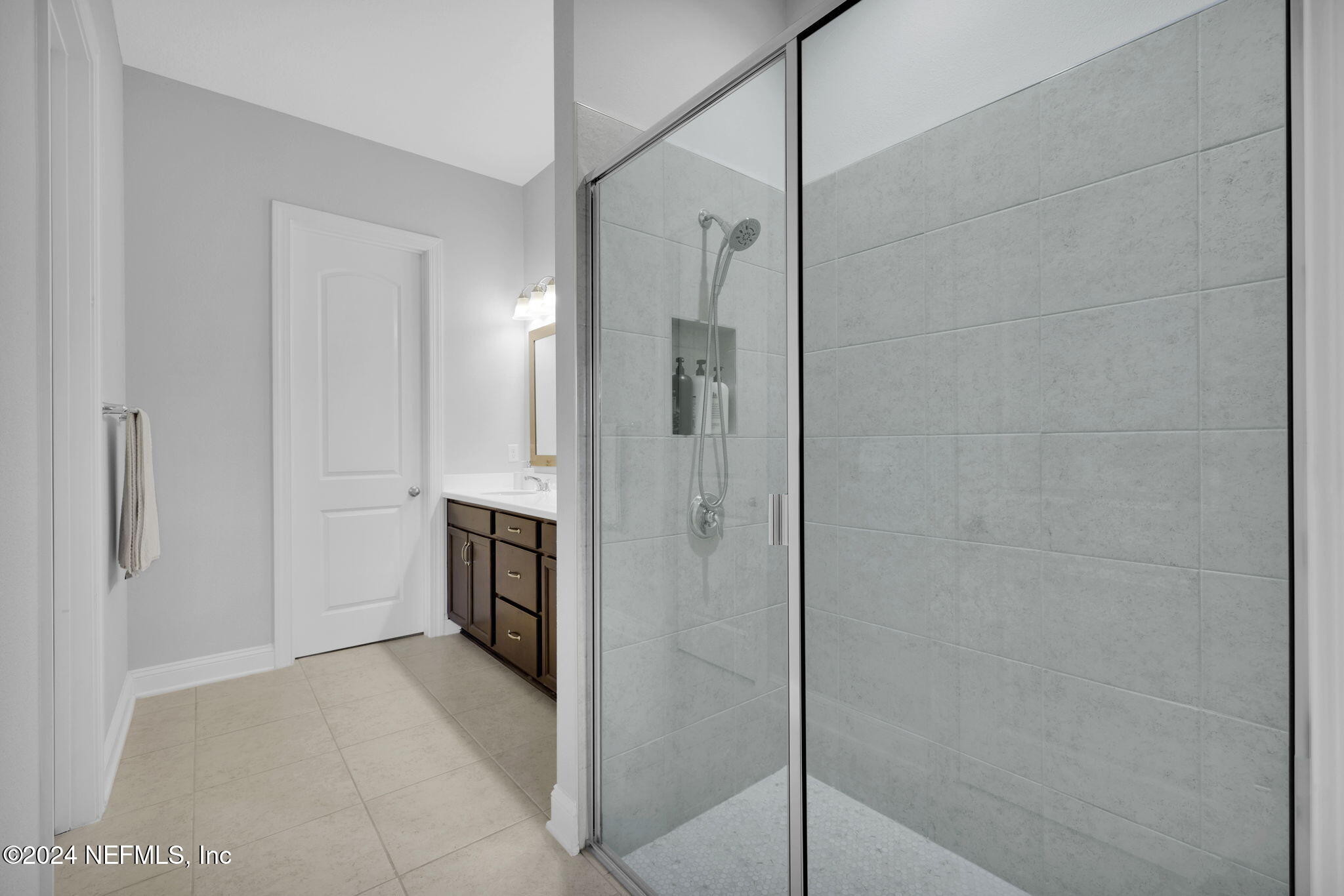217 Liberty Bell Road Ponte Vedra, FL 32081 - Photo 18 of 50 a bathroom with a shower and a sink