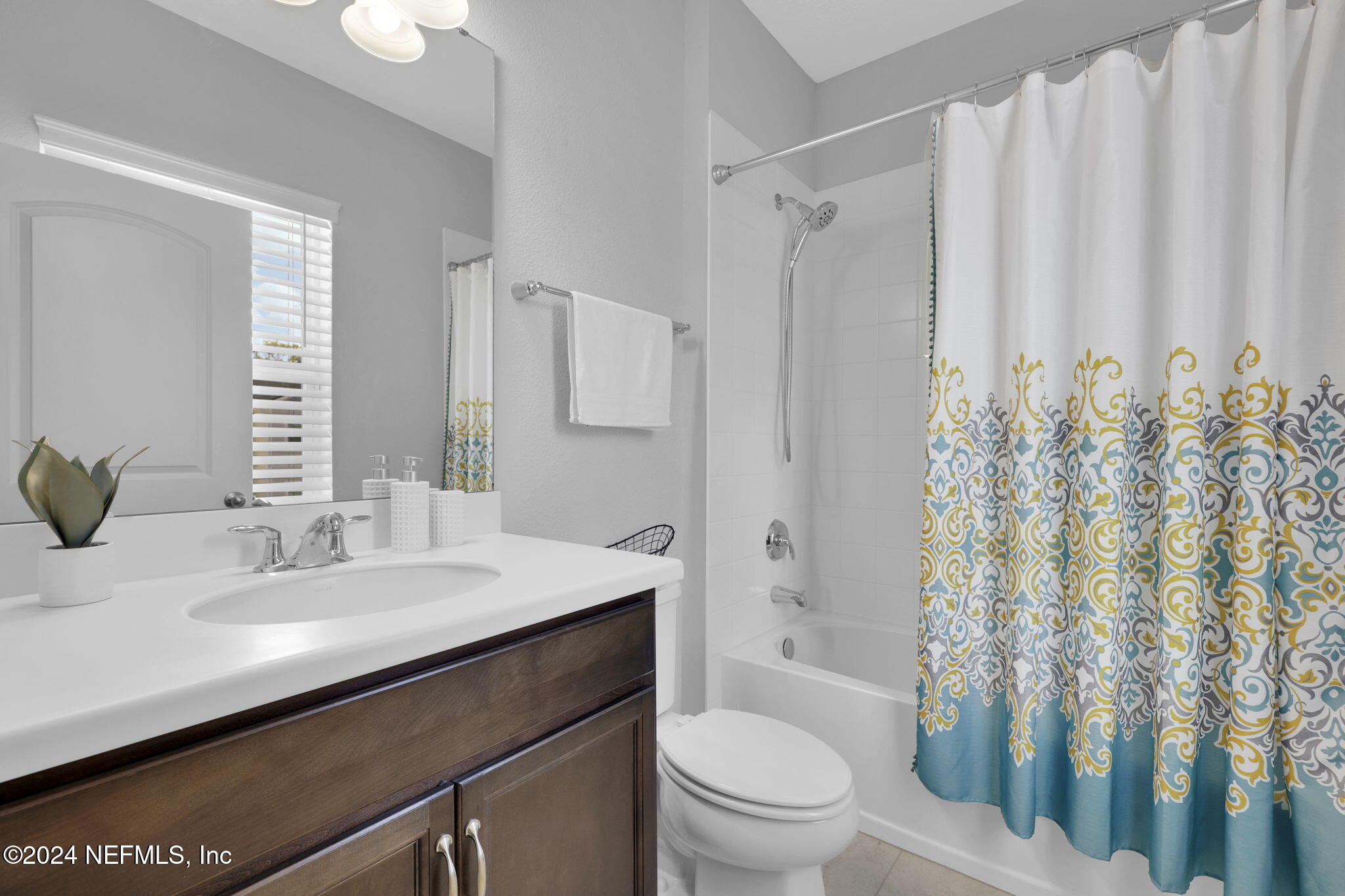 217 Liberty Bell Road Ponte Vedra, FL 32081 - Photo 25 of 50 a bathroom with a sink a toilet and shower curtain