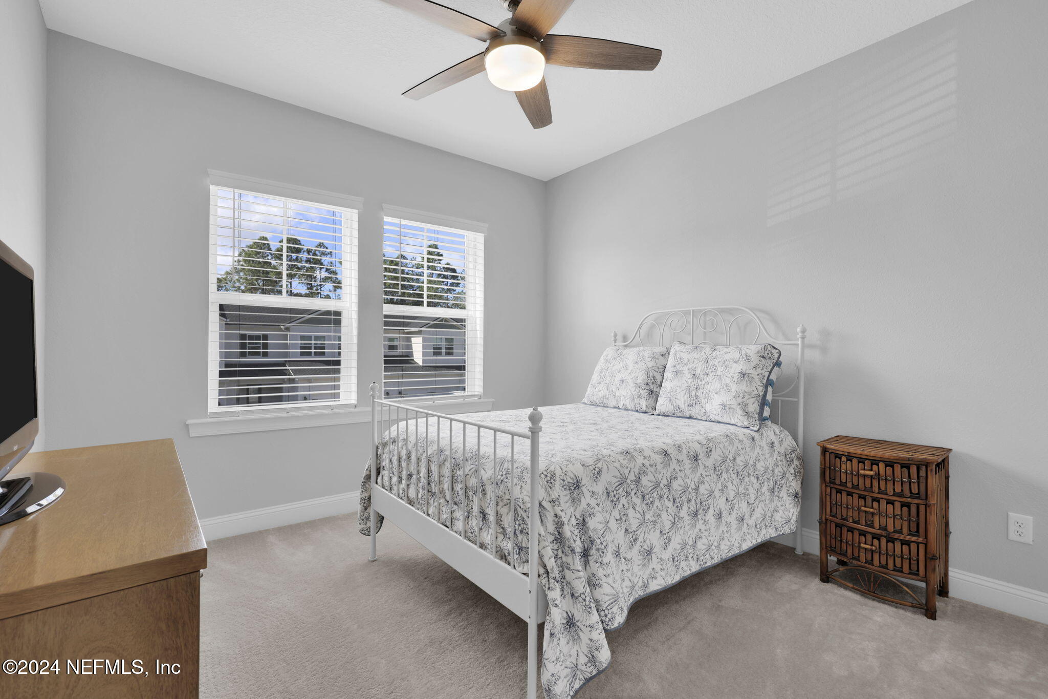 217 Liberty Bell Road Ponte Vedra, FL 32081 - Photo 26 of 50 a bed sitting in a bedroom next to a window