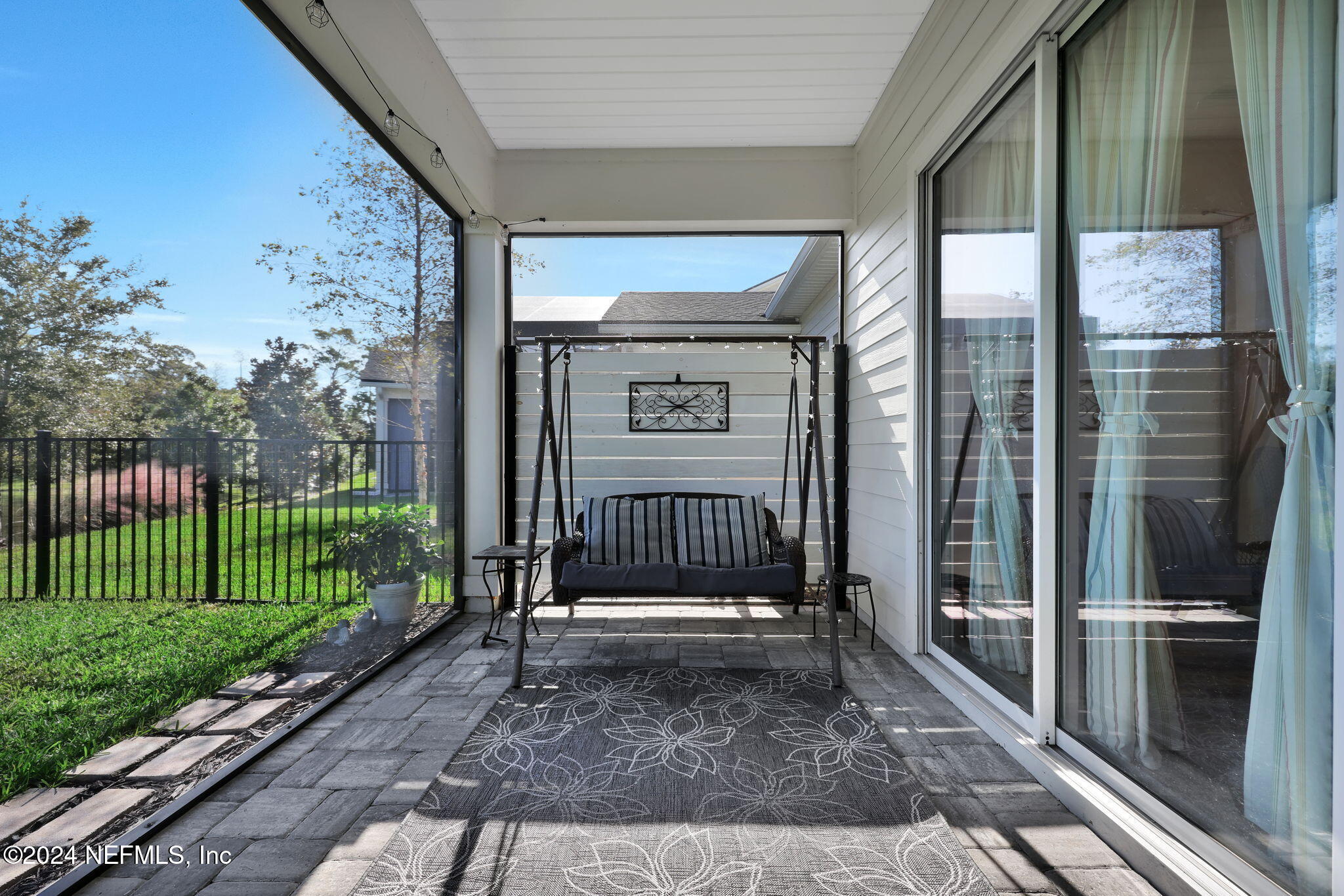 217 Liberty Bell Road Ponte Vedra, FL 32081 - Photo 28 of 50 a view of a porch with a floor to ceiling window