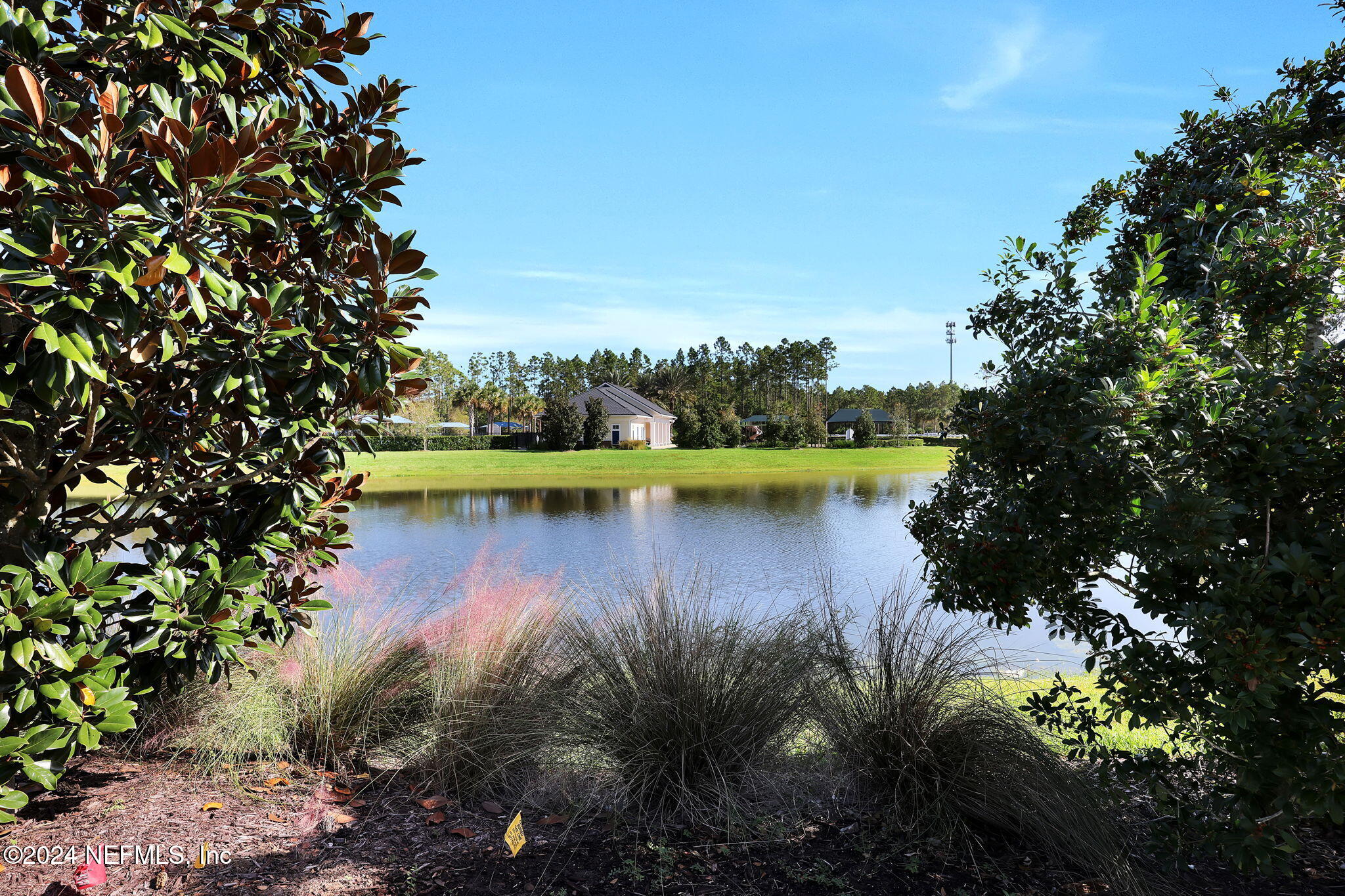 217 Liberty Bell Road Ponte Vedra, FL 32081 - Photo 32 of 50 a view of a lake with a house in the background