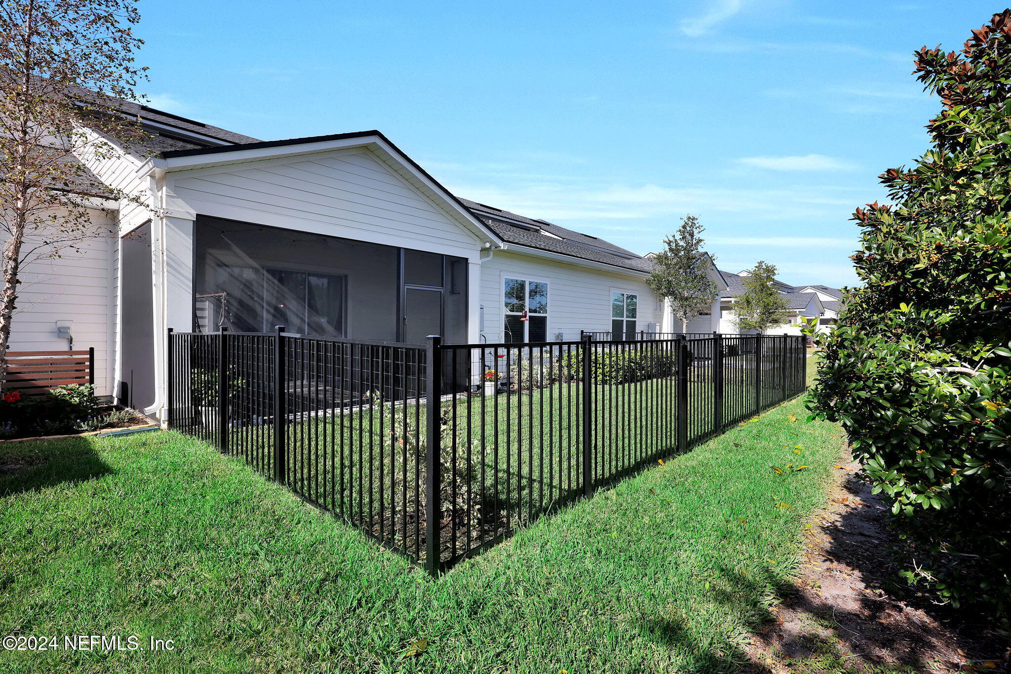 217 Liberty Bell Road Ponte Vedra, FL 32081 - Photo 35 of 50 a view of a house with a small yard and fence
