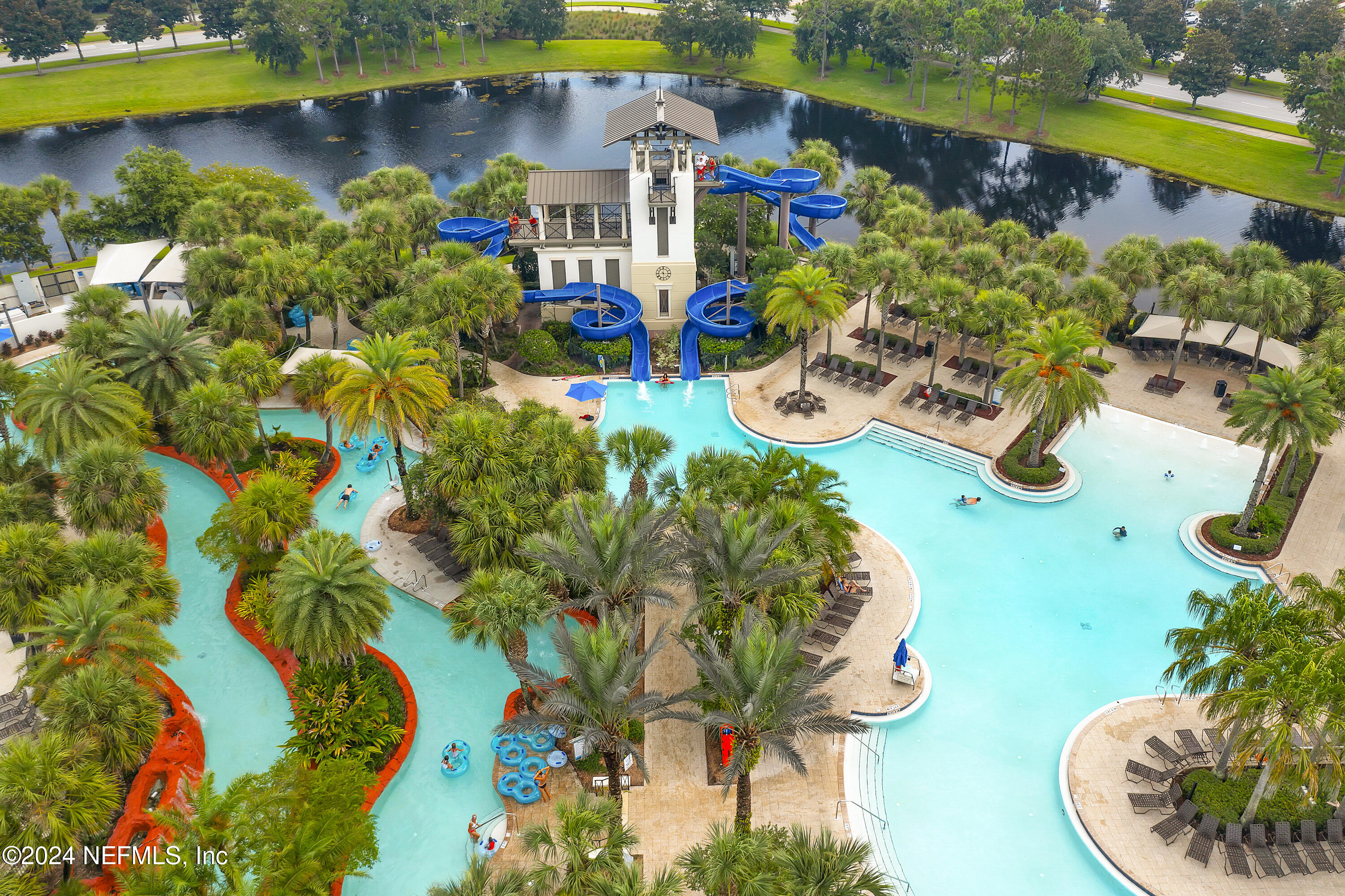 217 Liberty Bell Road Ponte Vedra, FL 32081 - Photo 37 of 50 a view of a swimming pool with a garden and plants