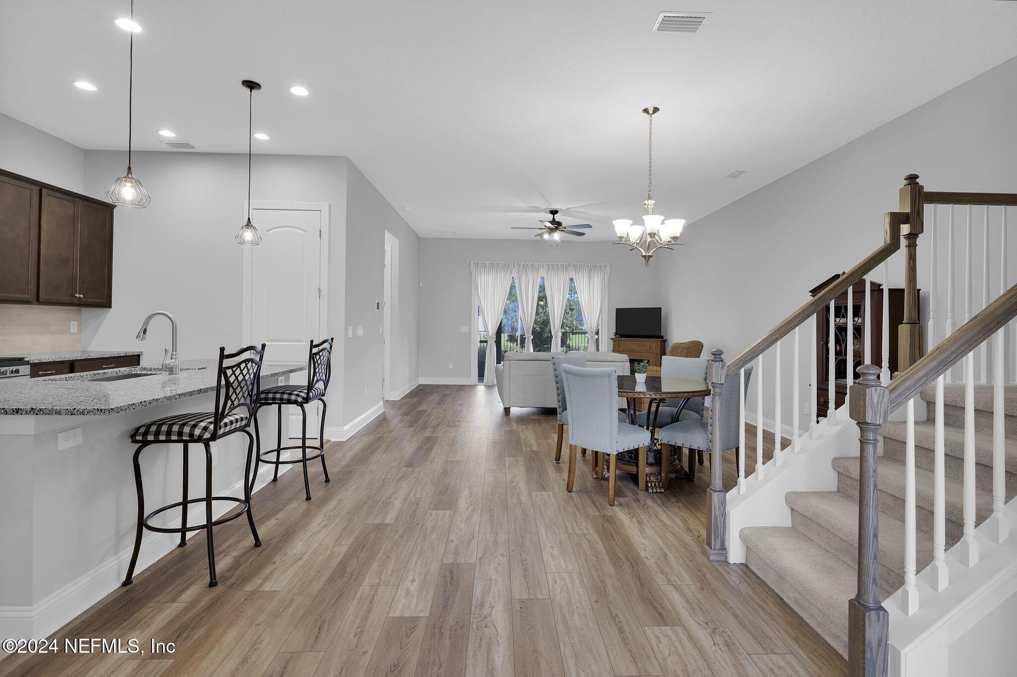 217 Liberty Bell Road Ponte Vedra, FL 32081 - Photo 5 of 50 a view of a dining room with furniture window and wooden floor