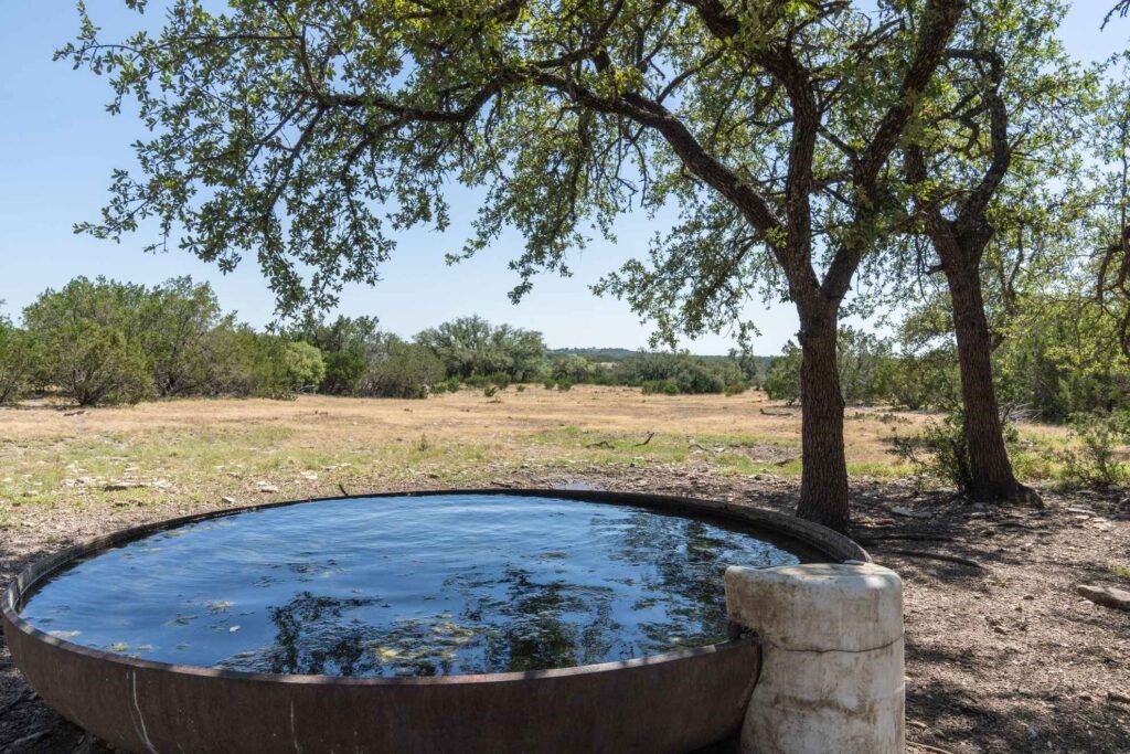 a view of a swimming pool with an outdoor space and seating area