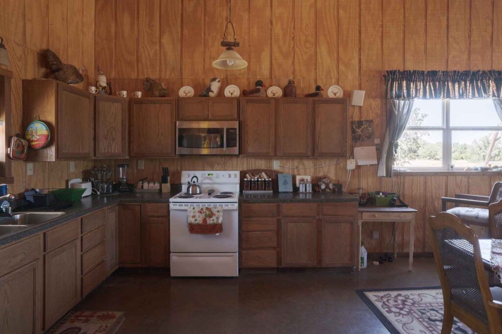 24 County Road 24 Junction, TX 76849 - Photo 20 of 37 a kitchen with a sink window and cabinets