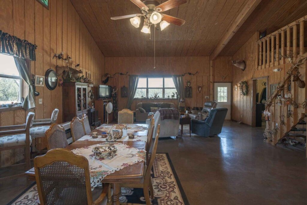 24 County Road 24 Junction, TX 76849 - Photo 21 of 37 a view of a dining room with furniture window and wooden floor