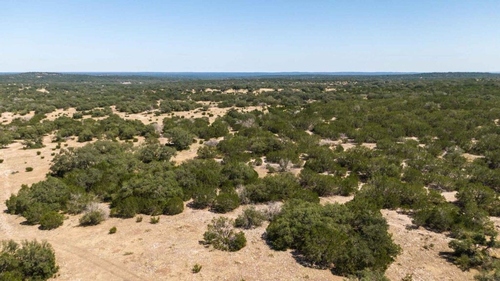 24 County Road 24 Junction, TX 76849 - Photo 34 of 37 an aerial view of residential houses with outdoor space