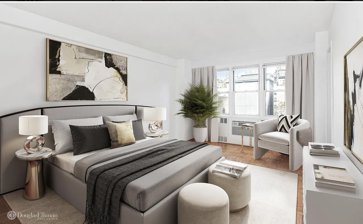 174 East 74th Street, Unit 10E Manhattan, NY 10021 - Photo 4 of 8 a bedroom with furniture and a large window