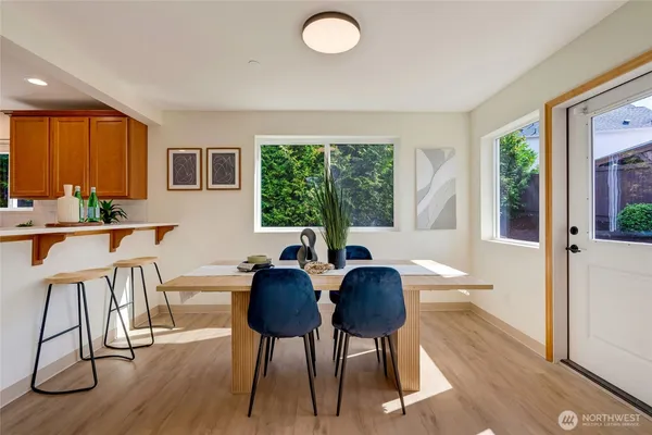 a view of a dining room with furniture window and outside view