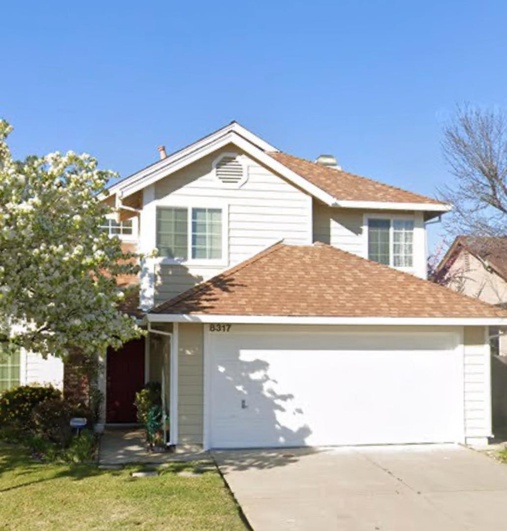 a view of house with yard outdoor seating and entertaining space