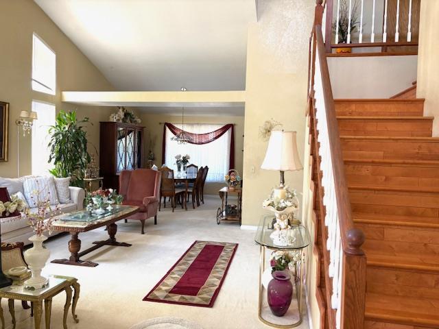 8317 Honeycomb Way Sacramento, CA 95828 - Photo 5 of 7 a living room with furniture and a chandelier
