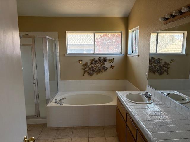 8317 Honeycomb Way Sacramento, CA 95828 - Photo 7 of 7 a bathroom with a granite countertop tub sink and mirror