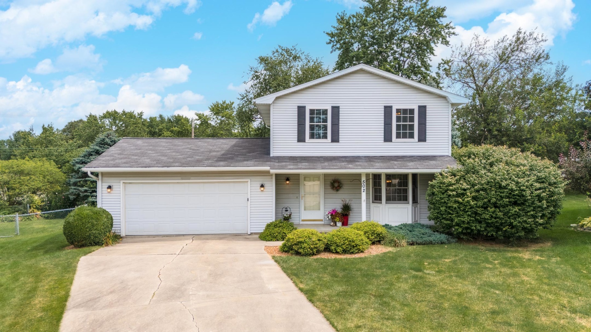 front view of a house with a yard