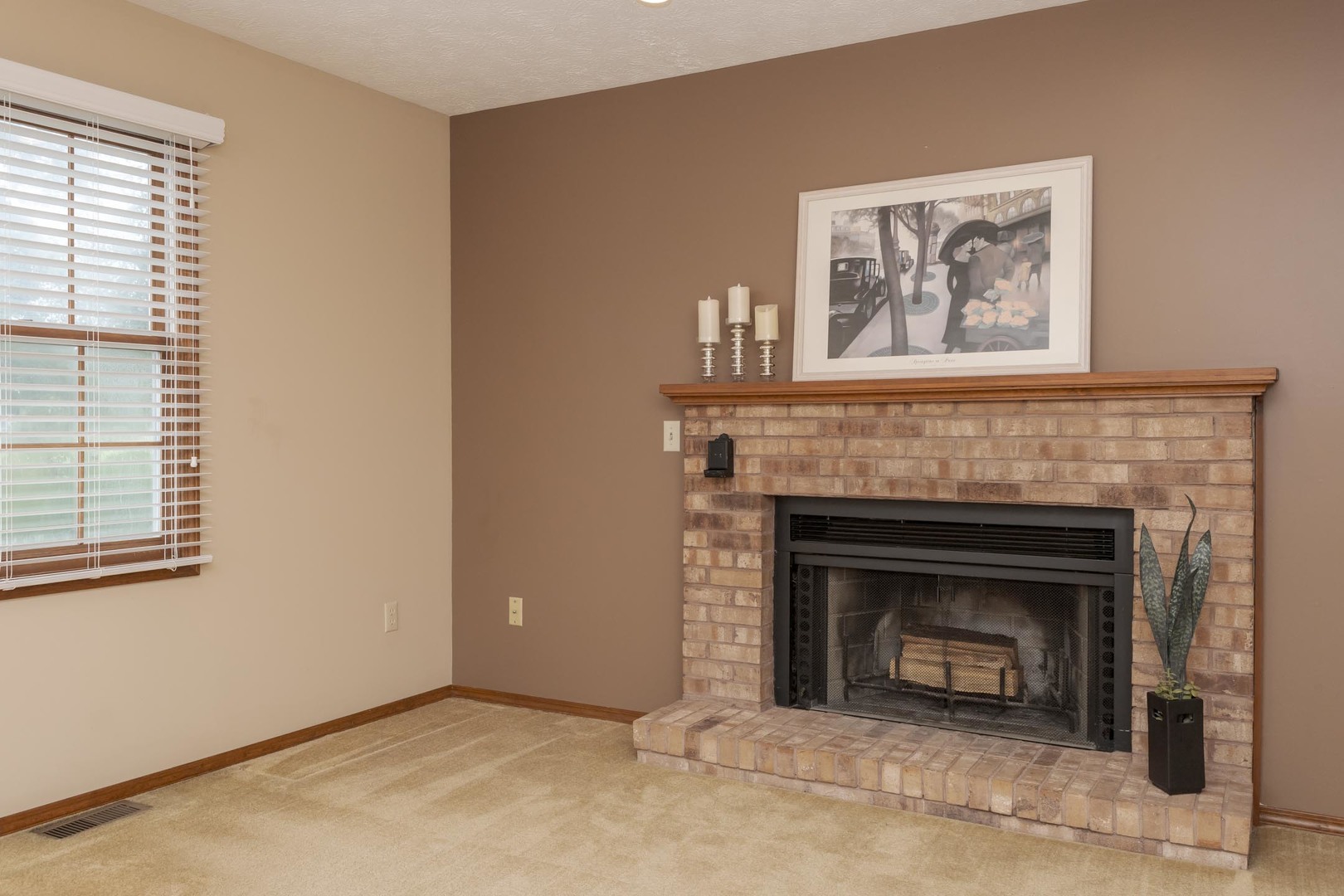 502 Wittenberg Court Normal, IL 61761 - Photo 13 of 41 a living room with a fireplace and a window