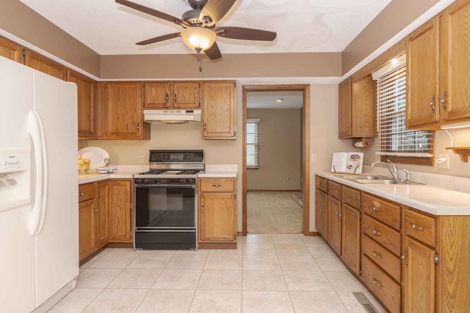 502 Wittenberg Court Normal, IL 61761 - Photo 16 of 41 a kitchen with stainless steel appliances granite countertop a stove and a refrigerator