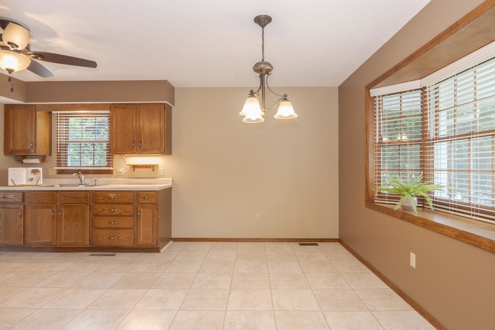 502 Wittenberg Court Normal, IL 61761 - Photo 21 of 41 a bathroom with a granite countertop sink a vanity and a large mirror