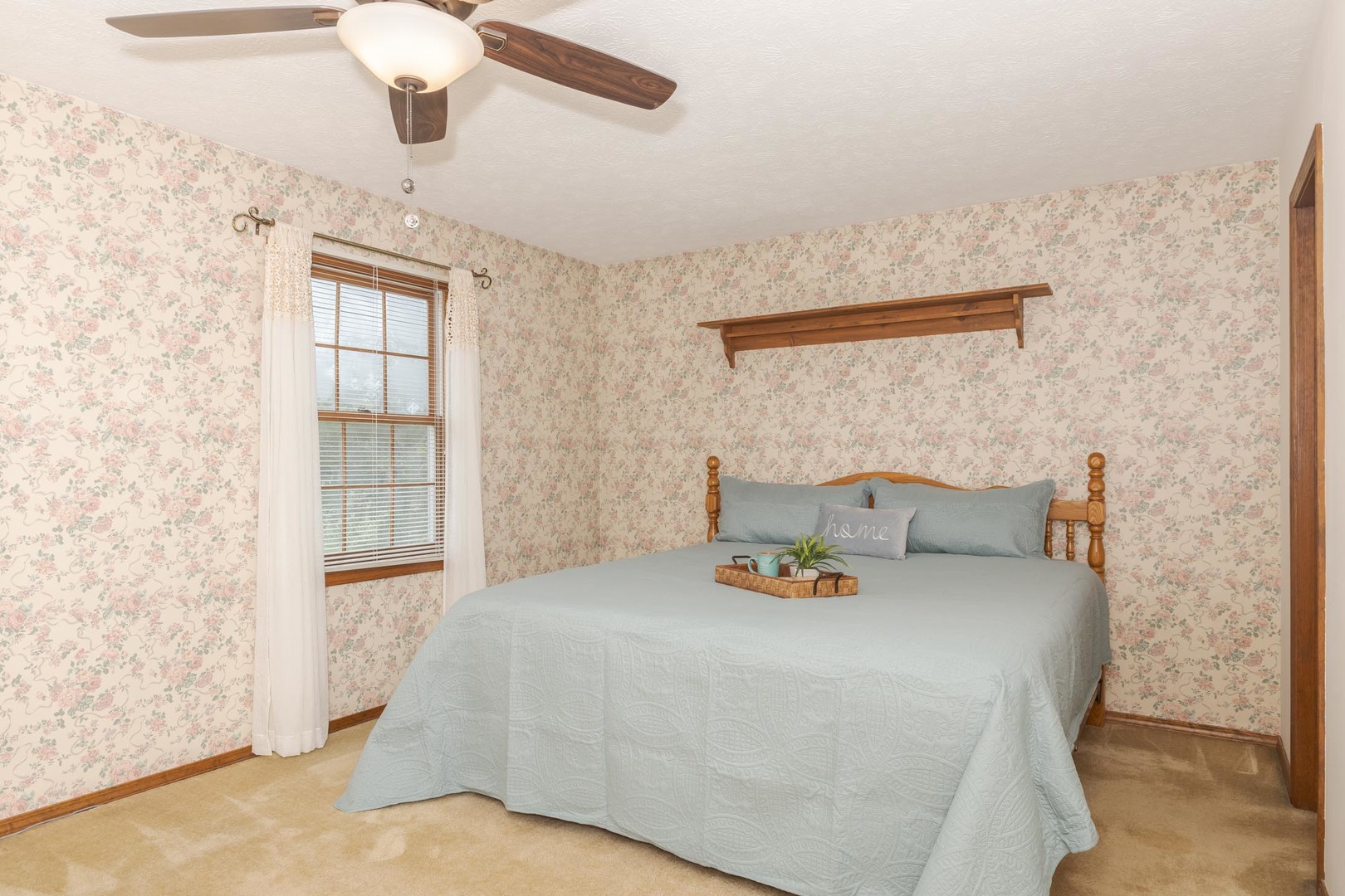 502 Wittenberg Court Normal, IL 61761 - Photo 23 of 41 a bed sitting in a bedroom next to a window and a chandelier fan