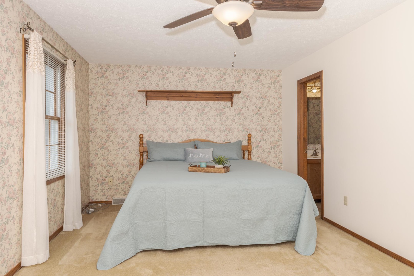 502 Wittenberg Court Normal, IL 61761 - Photo 24 of 41 a bedroom with a bed and a chandelier