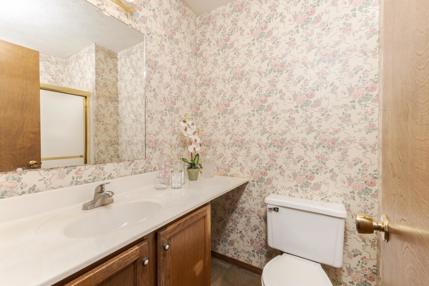 502 Wittenberg Court Normal, IL 61761 - Photo 26 of 41 a bathroom with a sink a toilet and a mirror