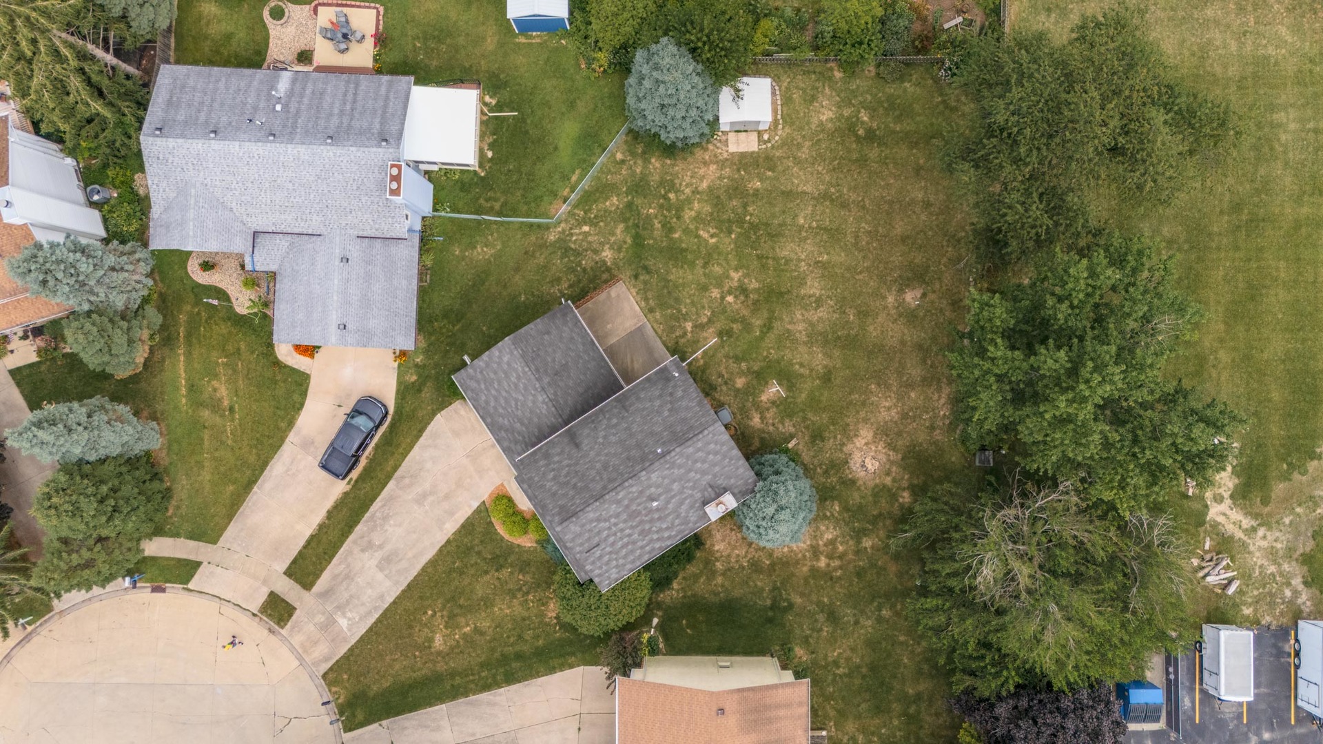 502 Wittenberg Court Normal, IL 61761 - Photo 4 of 41 an aerial view of a house with swimming pool and large trees