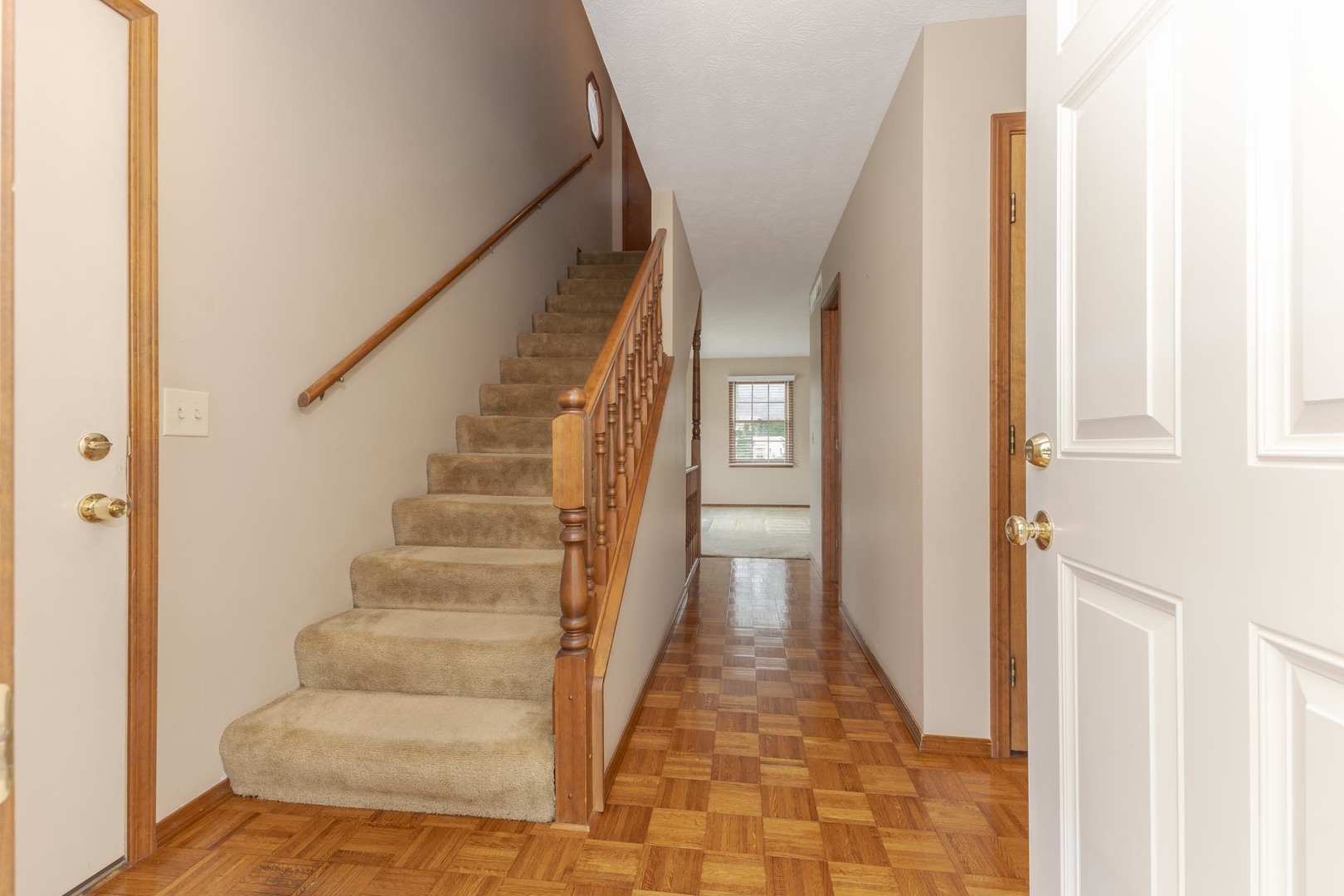 502 Wittenberg Court Normal, IL 61761 - Photo 8 of 41 a view of a hallway with wooden floor and entryway