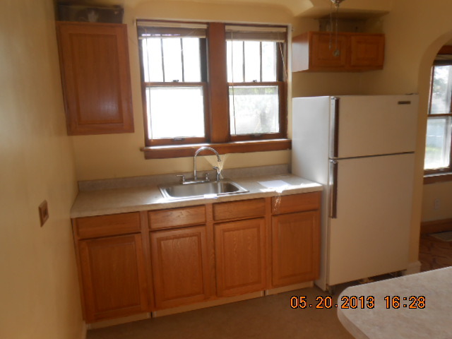 18142 Ridgewood Avenue Lansing, IL 60438 - Photo 8 of 11 a bathroom with a granite countertop sink and a window