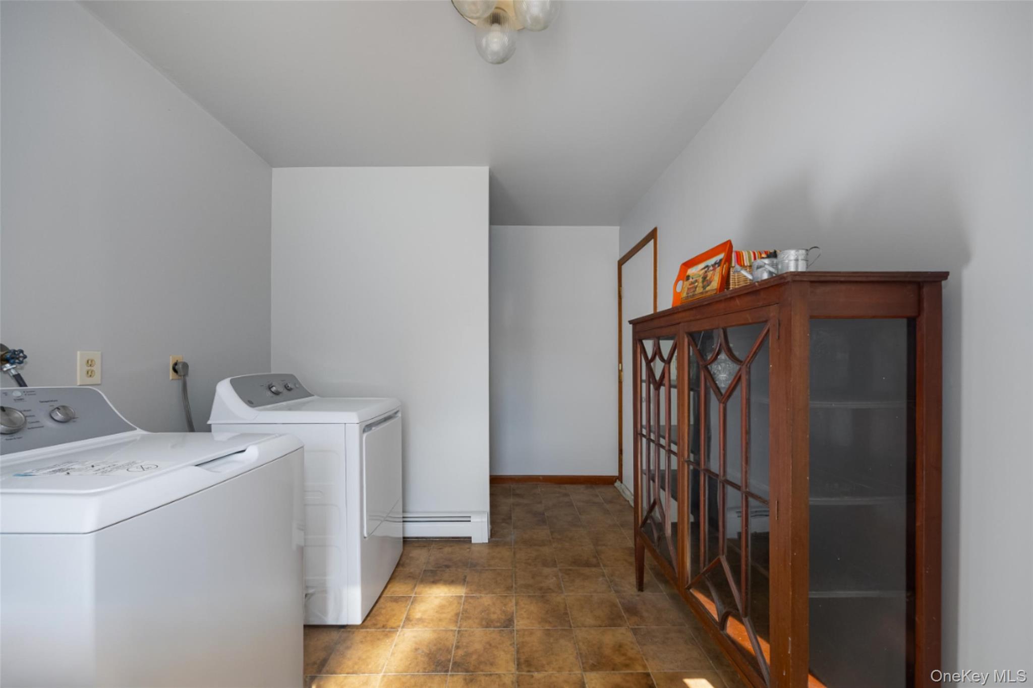 123 Brush Hill Road Millbrook, NY 12545 - Photo 12 of 29 Laundry room featuring new washer and dryer and ceramic floors
