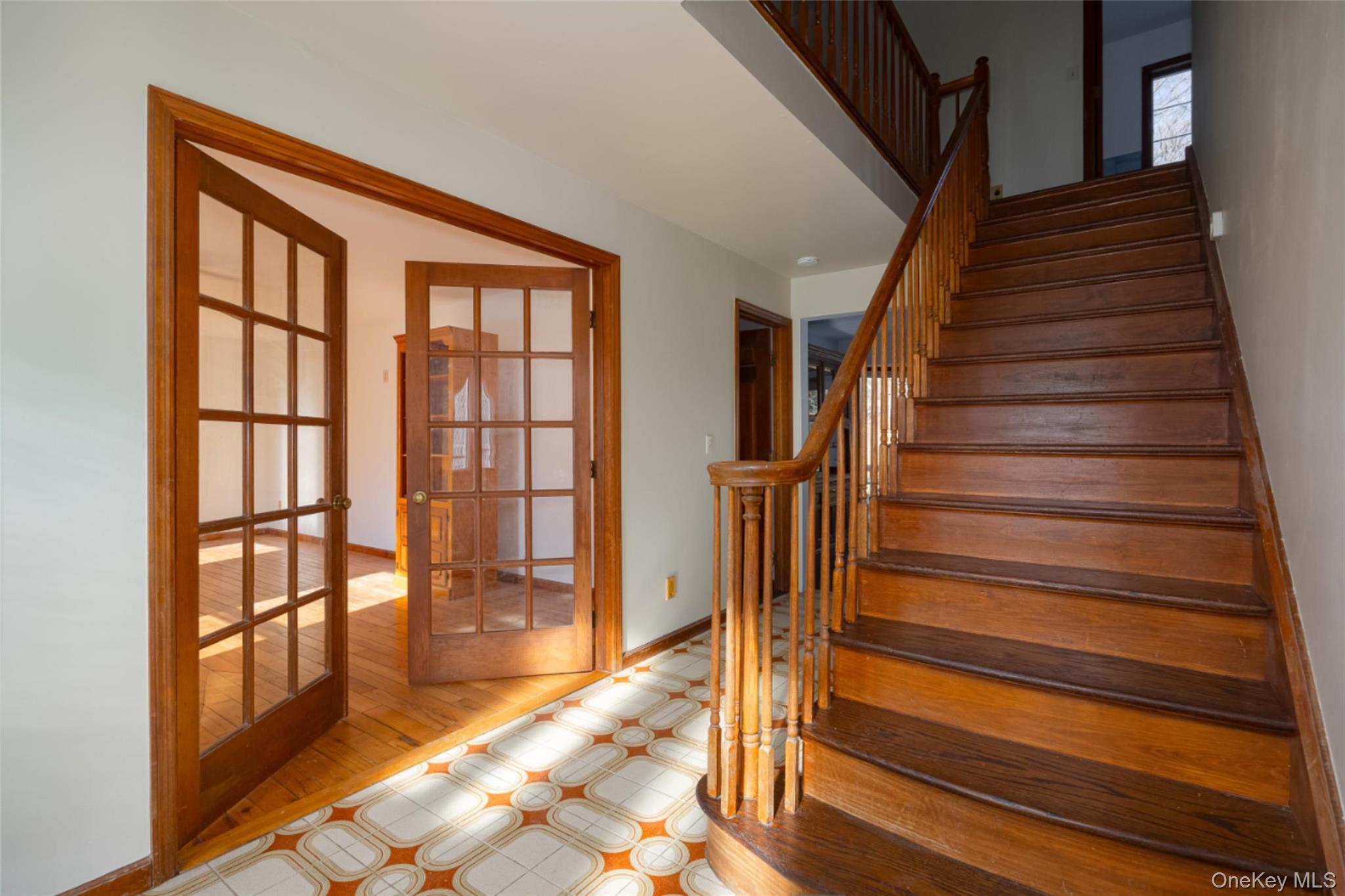 123 Brush Hill Road Millbrook, NY 12545 - Photo 5 of 29 Staircase featuring French doors and tile floors