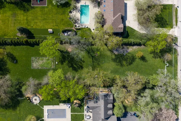 an aerial view of a house with pool yard outdoor seating and yard