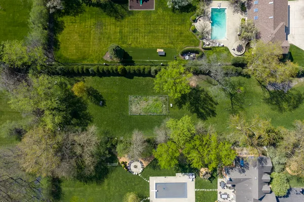 a aerial view of a house with a yard