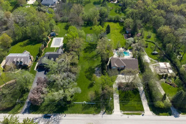 an aerial view of houses with yard