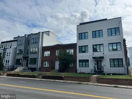 a view of a building next to a yard