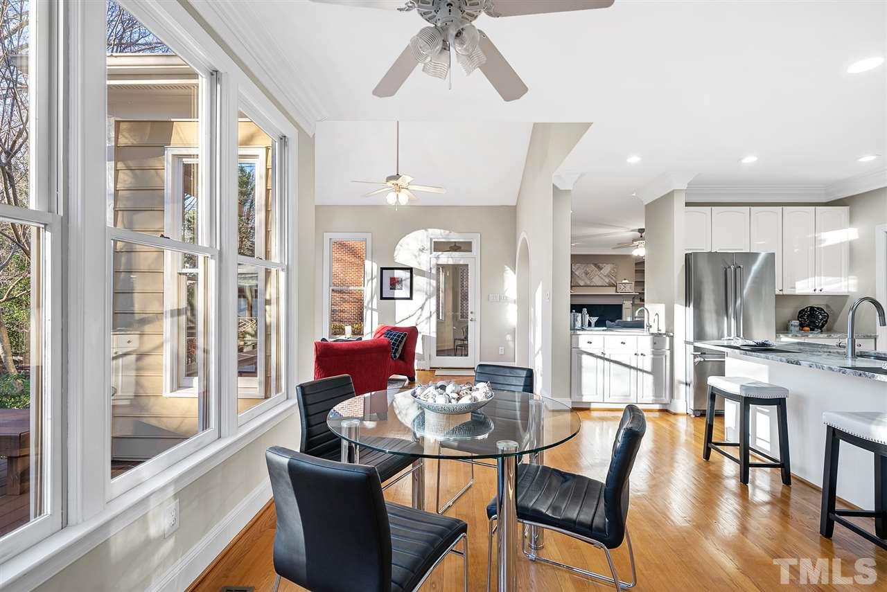 7605 Rainwater Road Raleigh, NC 27615 - Photo 11 of 30 a dining room with furniture and wooden floor