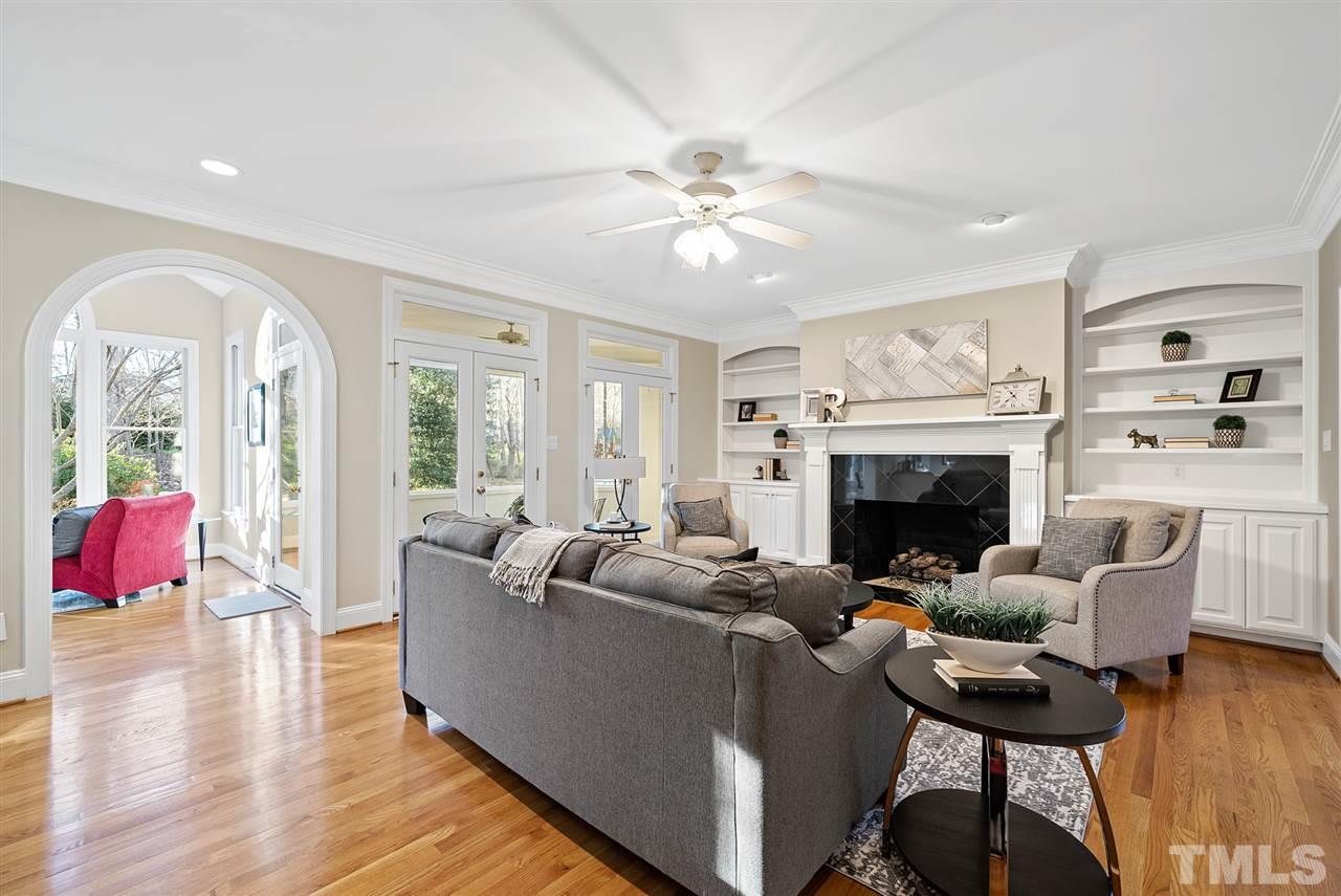 7605 Rainwater Road Raleigh, NC 27615 - Photo 15 of 30 a living room with furniture and a fireplace