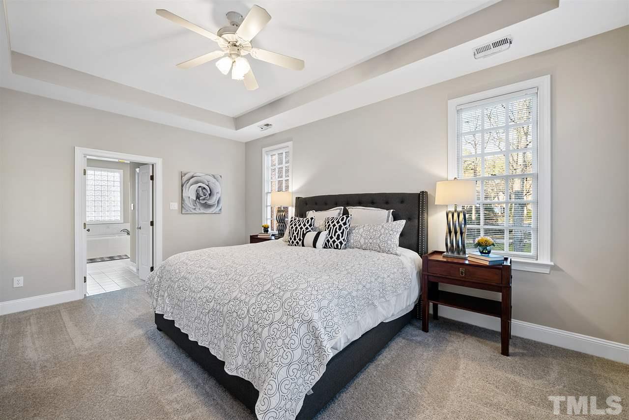 7605 Rainwater Road Raleigh, NC 27615 - Photo 16 of 30 a bedroom with a bed and window