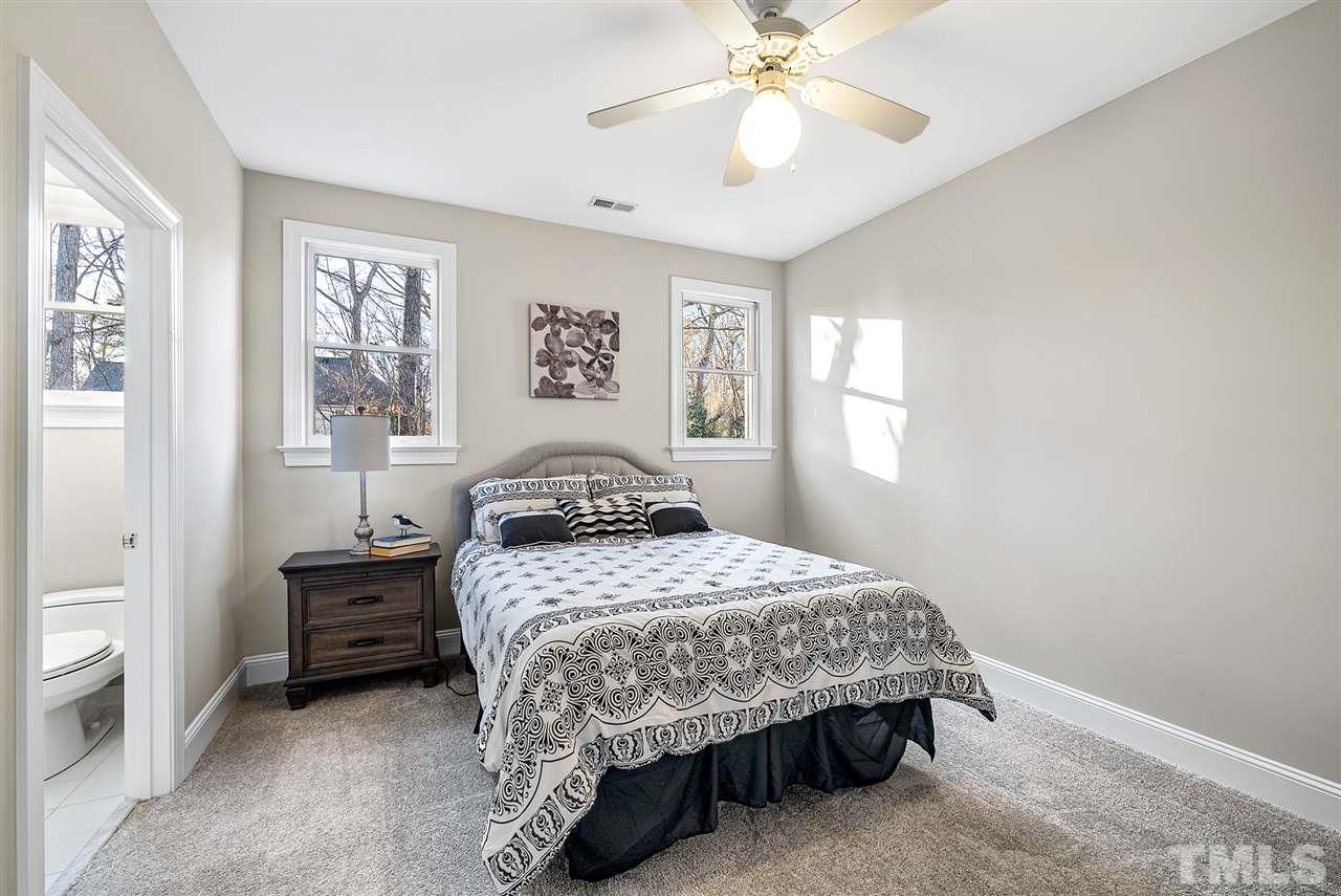 7605 Rainwater Road Raleigh, NC 27615 - Photo 19 of 30 a bedroom with a bed a rug and a window