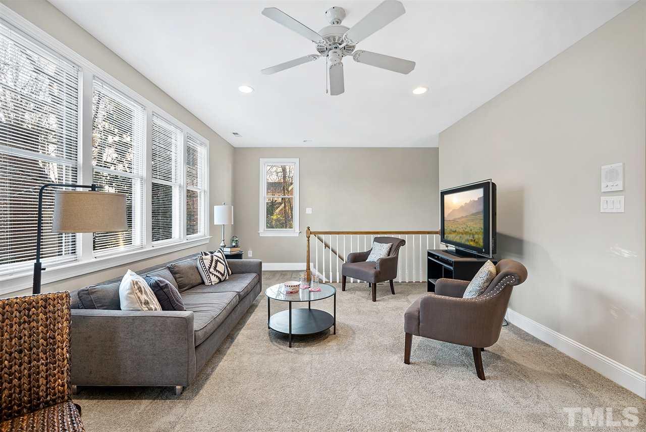 7605 Rainwater Road Raleigh, NC 27615 - Photo 25 of 30 a living room with furniture and a large window