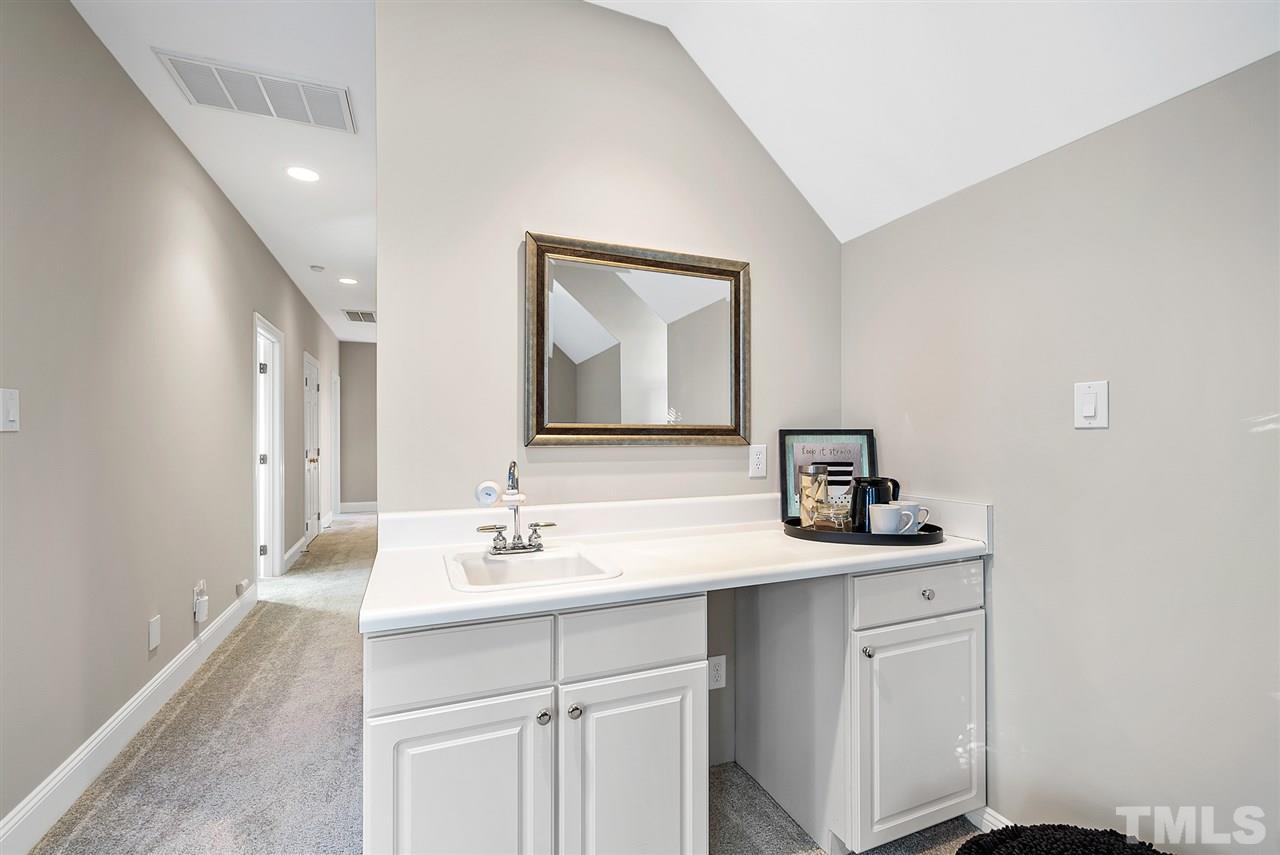 7605 Rainwater Road Raleigh, NC 27615 - Photo 26 of 30 a bathroom with a sink and a mirror