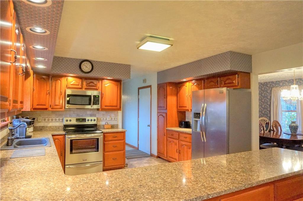 212 Holyoke Road Butler, PA 16001 - Photo 8 of 25 You will enjoy the tremendous space this kitchen offers! The lower pantry area (to the left of the refrigerator) features the pull out shelves!