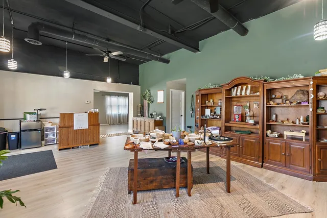 a outdoor space with lots of wooden furniture