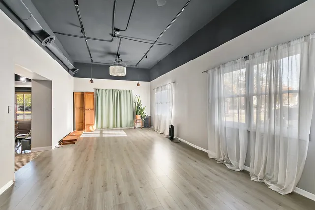 a view of hallway with wooden floor