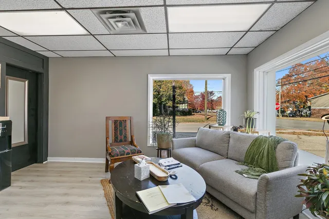 a living room with furniture and a large window