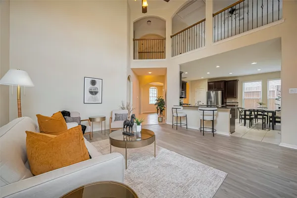 a kitchen with stainless steel appliances granite countertop a sink a stove a refrigerator and island