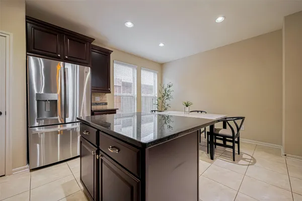 a view of a livingroom with a ceiling fan and window