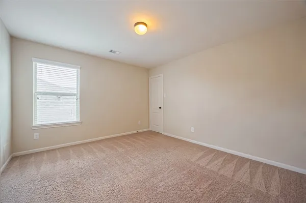 a bathroom with a granite countertop sink and a bathtub