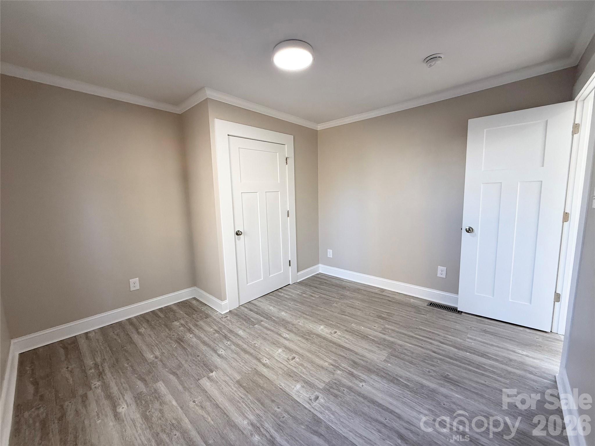 438 Pop Davis Road Taylorsville, NC 28681 - Photo 14 of 31 a view of an empty room with wooden floor