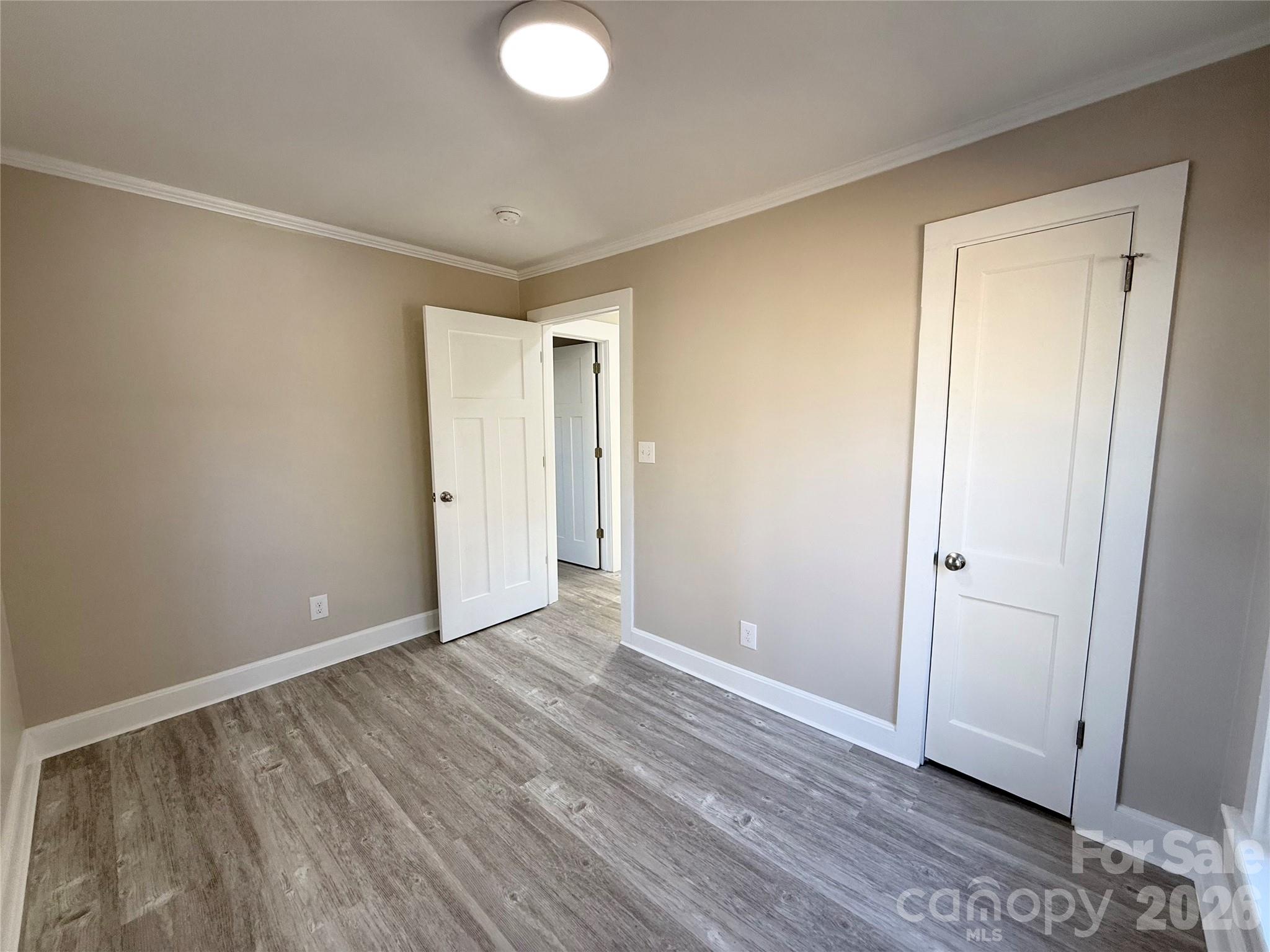 438 Pop Davis Road Taylorsville, NC 28681 - Photo 18 of 31 a view of an empty room and wooden floor