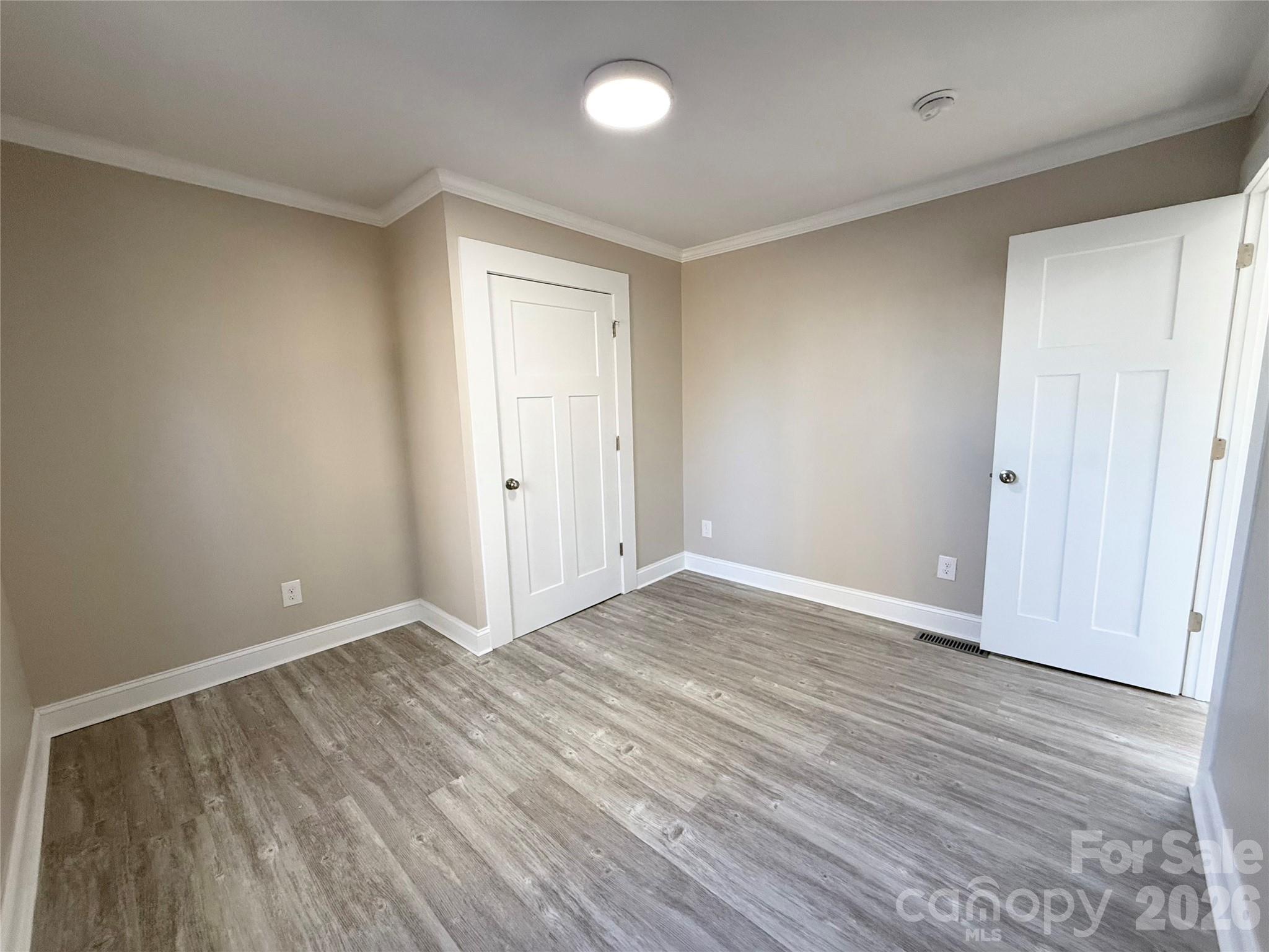438 Pop Davis Road Taylorsville, NC 28681 - Photo 19 of 31 a view of an empty room with wooden floor and a window